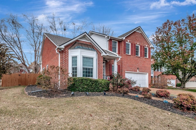 view of front property with a front lawn and a garage