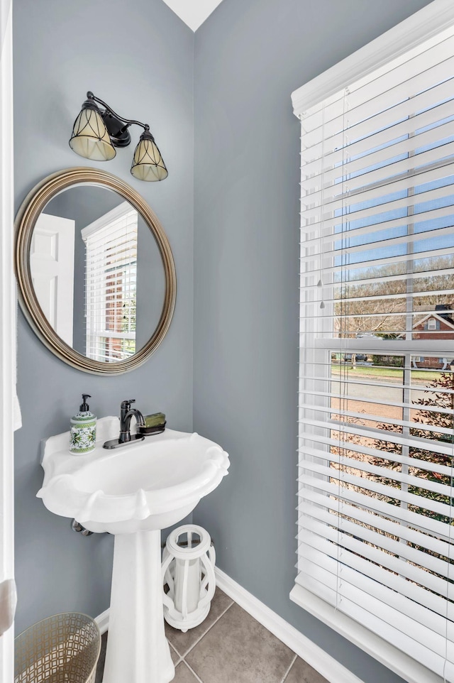 bathroom with tile patterned floors