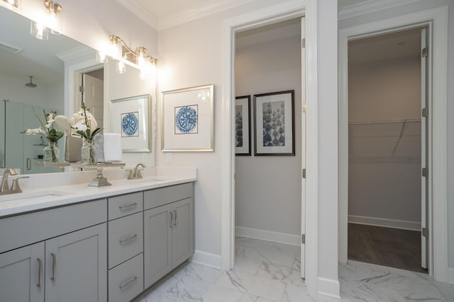 bathroom featuring an enclosed shower, vanity, and ornamental molding