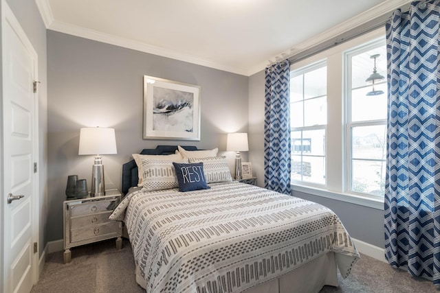 bedroom with dark colored carpet and ornamental molding