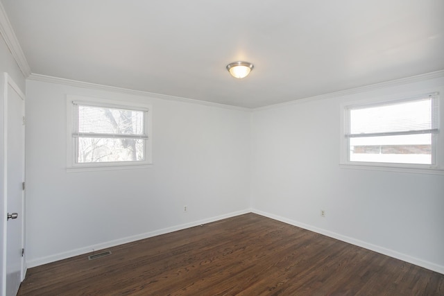 unfurnished room with crown molding and dark hardwood / wood-style floors