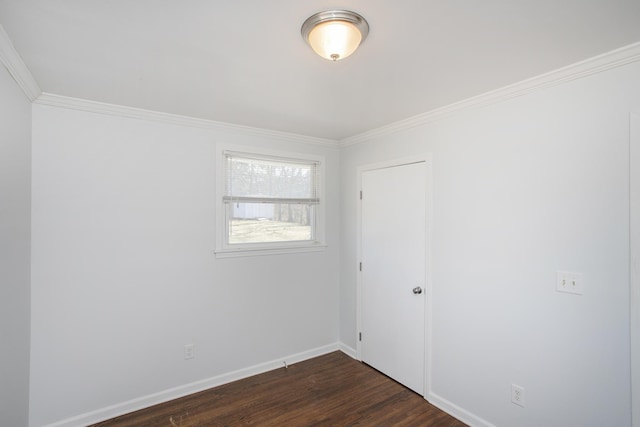 unfurnished room with crown molding and dark hardwood / wood-style flooring