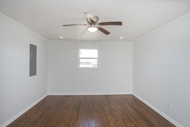 empty room featuring crown molding, ceiling fan, dark hardwood / wood-style floors, and electric panel