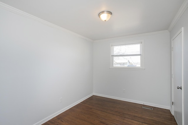 unfurnished room featuring ornamental molding and dark hardwood / wood-style flooring