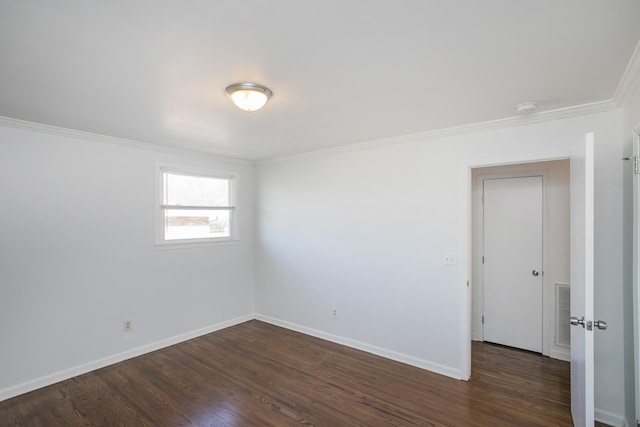 unfurnished room featuring crown molding and dark hardwood / wood-style floors