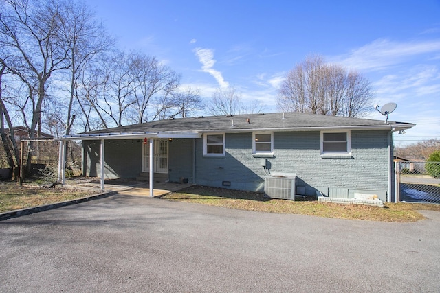 rear view of property featuring central air condition unit