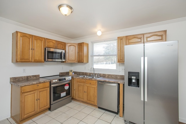 kitchen featuring crown molding, stainless steel appliances, sink, and light tile patterned floors