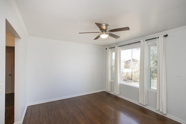 unfurnished room featuring ceiling fan, ornamental molding, and dark hardwood / wood-style floors