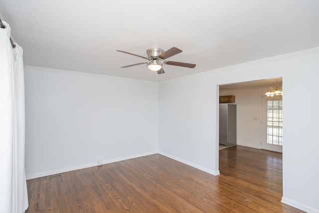 unfurnished room featuring ceiling fan with notable chandelier, dark wood-type flooring, and ornamental molding