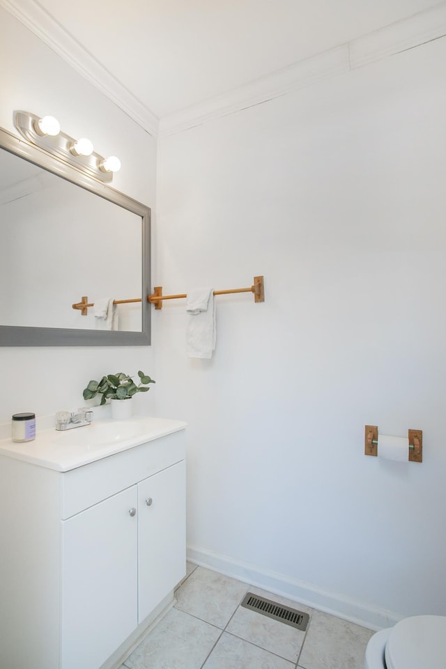 bathroom featuring crown molding, tile patterned floors, vanity, and toilet