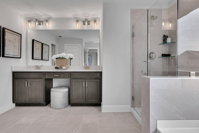 bathroom featuring vanity and a shower with door