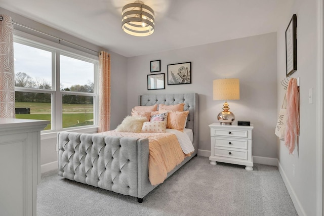 bedroom with light colored carpet