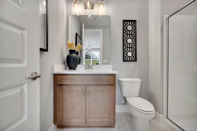 bathroom with toilet, an enclosed shower, vanity, and a chandelier