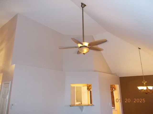 room details with ceiling fan with notable chandelier