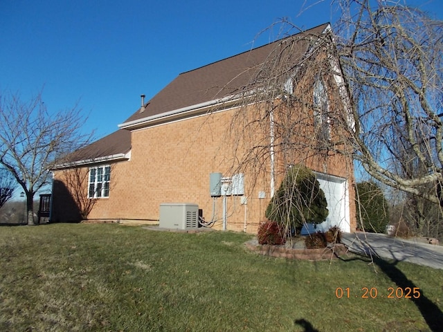 view of home's exterior with a lawn