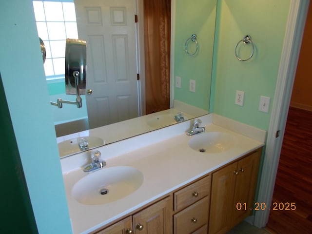 bathroom featuring vanity and hardwood / wood-style floors