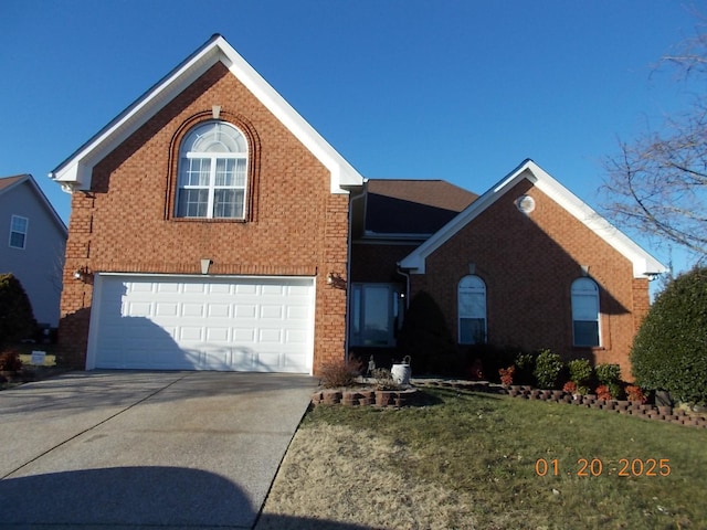 front of property with a front yard and a garage