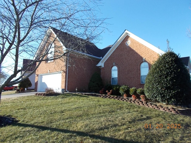 view of home's exterior featuring a yard and a garage