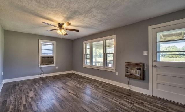 3352 Dumor Deer Lick Rd, Lewisburg, KY 42256 - interior space with dark wood-type flooring, a healthy amount of sunlight, heating unit, and a textured ceiling