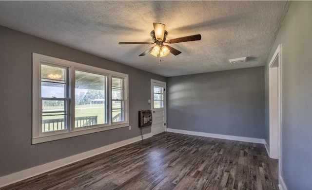 3352 Dumor Deer Lick Rd, Lewisburg, KY 42256 - unfurnished room with ceiling fan, a textured ceiling, dark hardwood / wood-style floors, and heating unit