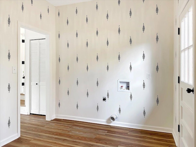 washroom with washer hookup and hardwood / wood-style floors