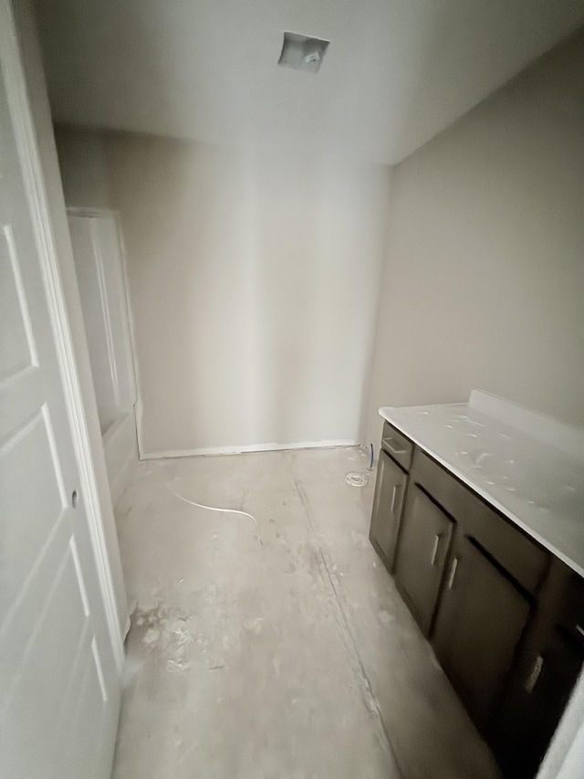 bathroom featuring vanity and a bath