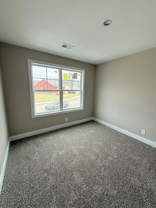 unfurnished room featuring carpet flooring