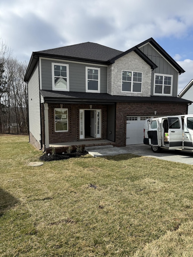 view of front facade with a garage and a front lawn