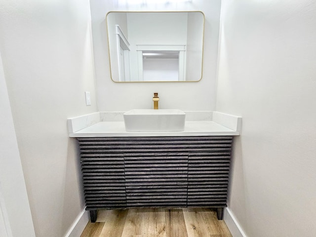 bathroom with wood-type flooring and vanity