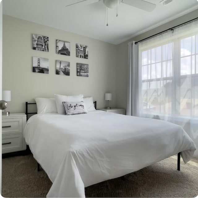 carpeted bedroom with ceiling fan