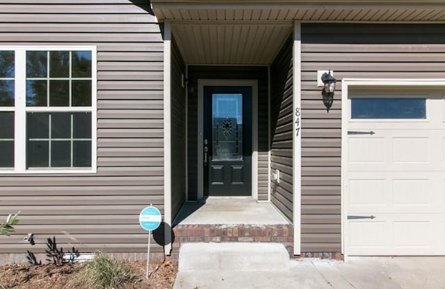 property entrance with a garage