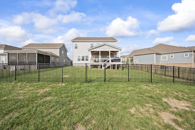 exterior space featuring a sunroom and a yard