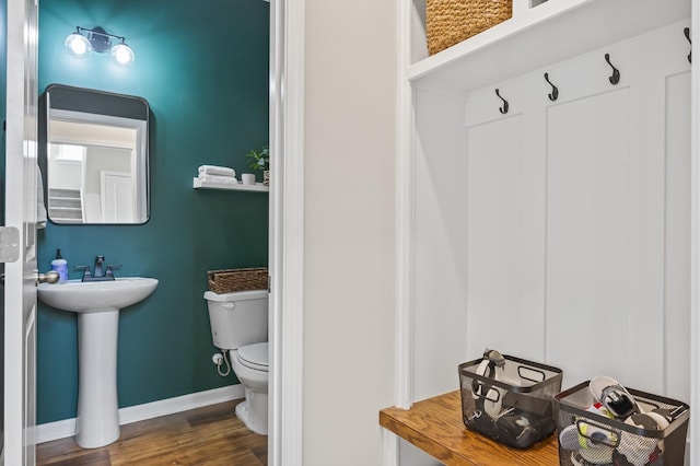 bathroom with sink, wood-type flooring, and toilet