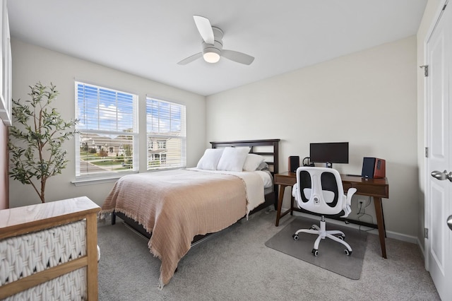 bedroom featuring ceiling fan and light colored carpet