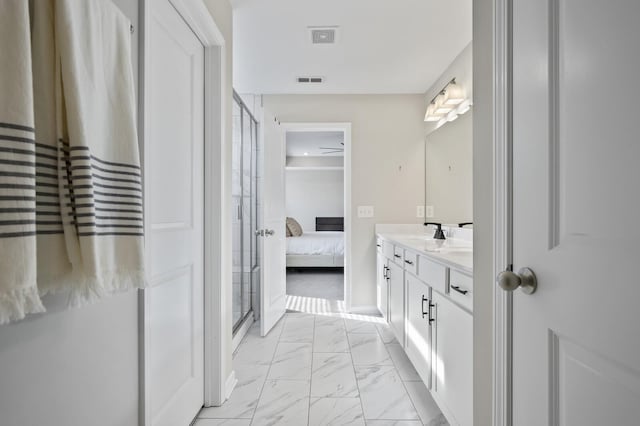 bathroom featuring vanity and a shower