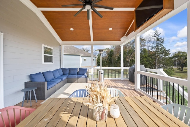 deck featuring an outdoor hangout area and ceiling fan