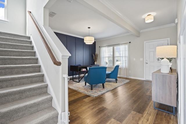 dining area with beam ceiling, dark wood-type flooring, and ornamental molding