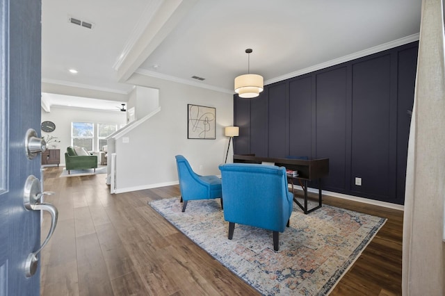 dining area featuring dark hardwood / wood-style floors and crown molding