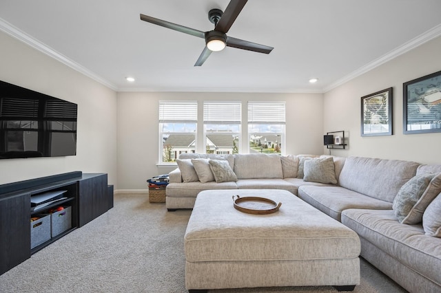 carpeted living room featuring ceiling fan and ornamental molding