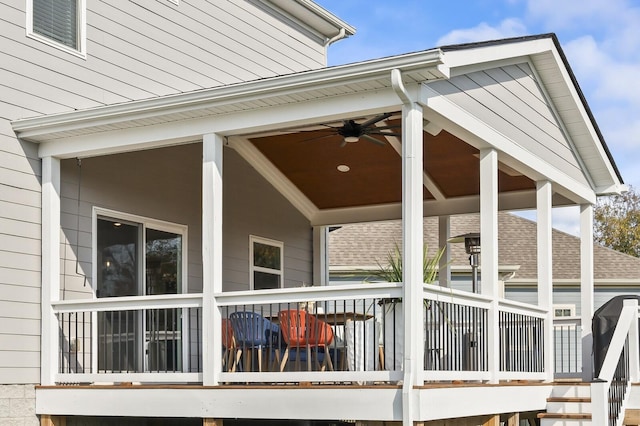 exterior space with ceiling fan