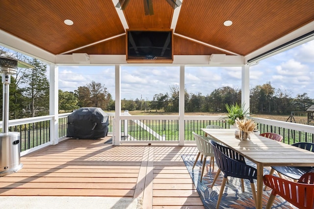 sunroom featuring vaulted ceiling, wooden ceiling, and a wealth of natural light