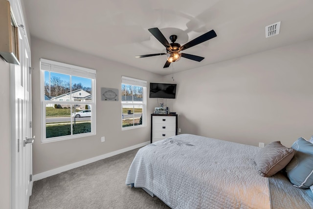 carpeted bedroom featuring ceiling fan