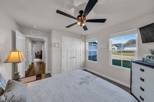 bedroom with ceiling fan and a closet