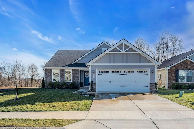 craftsman inspired home featuring a garage and a front yard