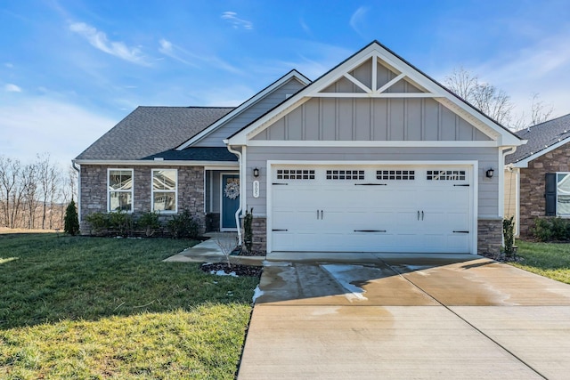 craftsman-style house featuring a front lawn and a garage