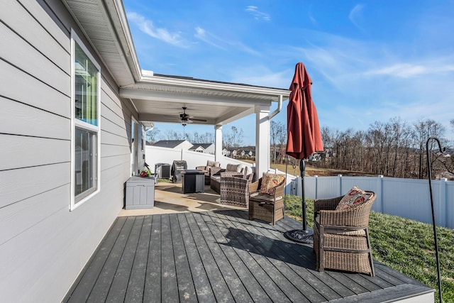 deck featuring an outdoor living space and ceiling fan