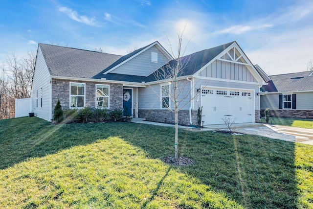 view of front of home featuring a front lawn and a garage