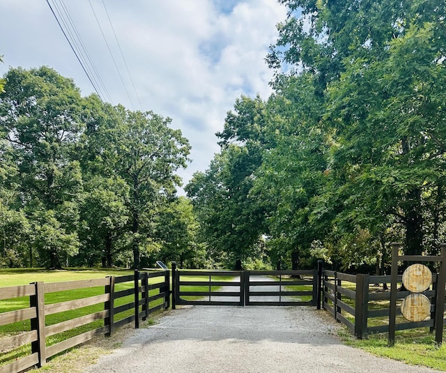 view of gate featuring a rural view