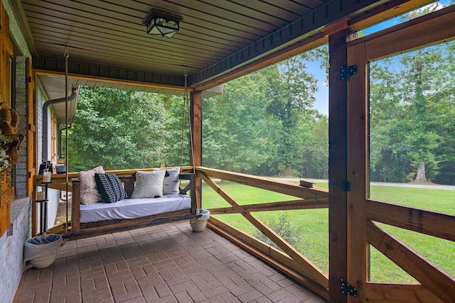 wooden deck featuring french doors and a lawn