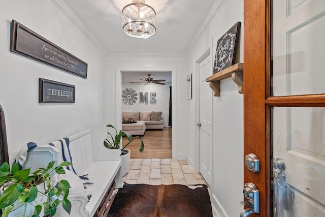 mudroom featuring ceiling fan with notable chandelier and crown molding